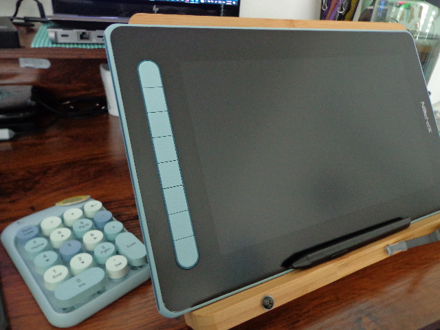 a drawing tablet with a blue trim and blue number keypad
